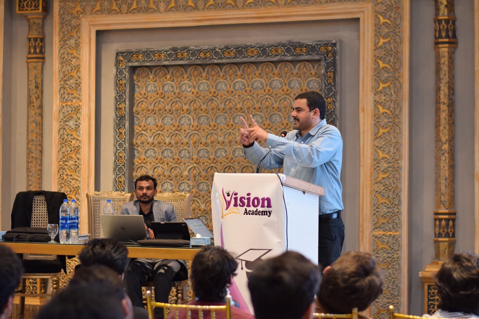 Sir Husain Bari addressing students during a lecture